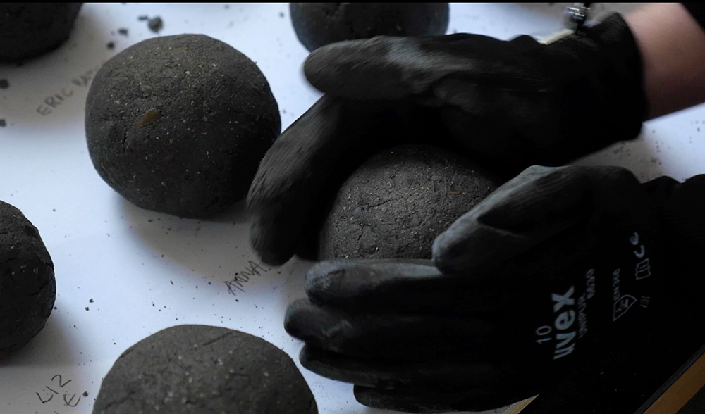 Making the concrete balls ahead of the bowling tournament © Liam O’Connor