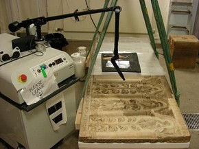 Figure 2 -Combined poultice and laser cleaning of a Florentine marble sarcophagus front from the 14th century (Museum no. 46-1882) with an Nd:YAG-laser in the V&A Sculpture Conservation Studio for display in the Medieval and Renaissance Galleries