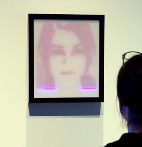 Figure 2 - 'Study for a mirror', rAndom International, 2008. The collaborator stands in front of the frame for a few minutes, while an embedded scanner produces a temporary image. Photography by Peter Kelleher
