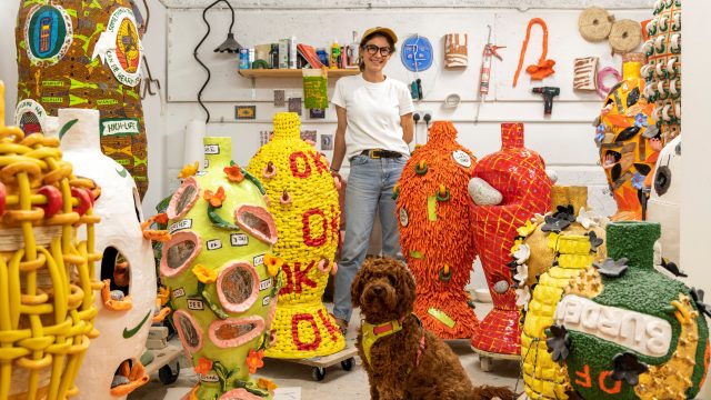 Artist Xanthe Somers standing in her studio