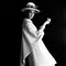 Grace Coddington in white coat and hat