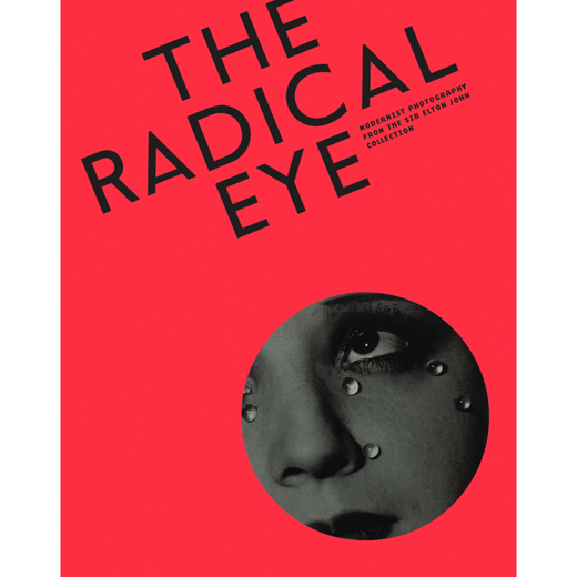A bright red book cover. The detail of a black and white photograph of a woman's face is cropped within a circle at the bottom right corner of the cover. 