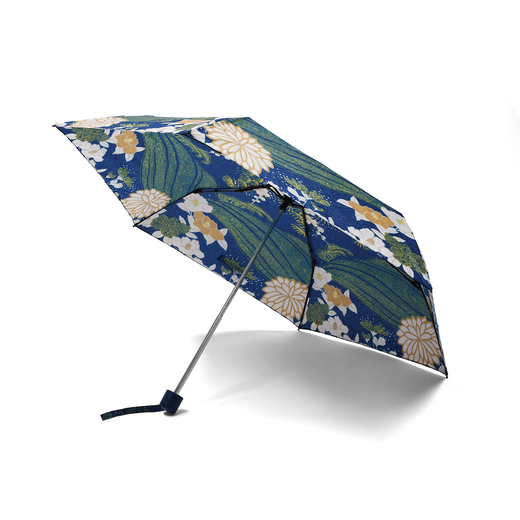 An open umbrella featuring a Japanese inspired blue and green print.