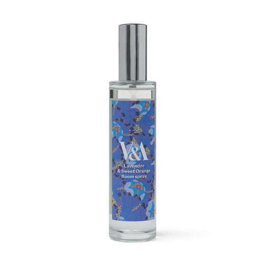 A clear tall glass bottle with a blue label featuring a floral pattern and a silver lid.