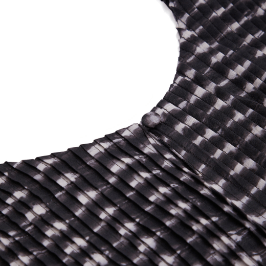 A close up of the collar of a black and white shirt.