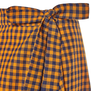 A detail of an orange and brown check bow.