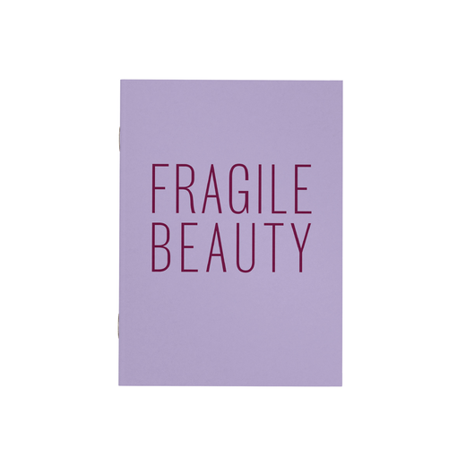 Lilac notebook featuring the text 'Fragile Beauty' in the centre.