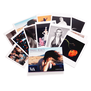 A postcard pack with twelve postcards featuring various photographs spread on a white background.