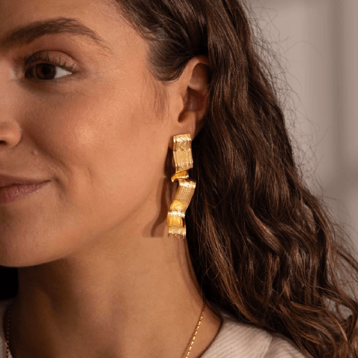 Long ribbon drop stud earrings by Emma Calvert
