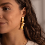 Long ribbon drop stud earrings by Emma Calvert