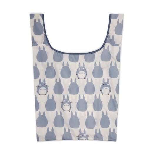 A white tote bag with a pattern featuring an animal cartoon character.