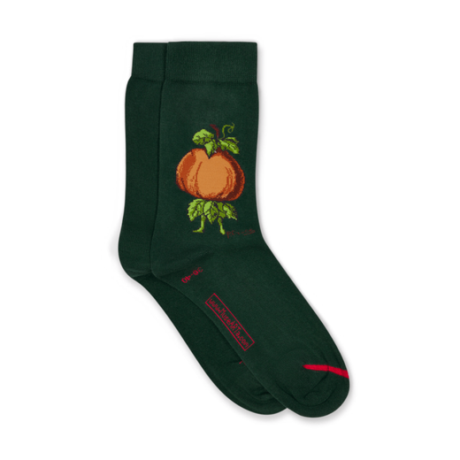 A pair of dark green socks featuring an illustration of an orange pumpkin.