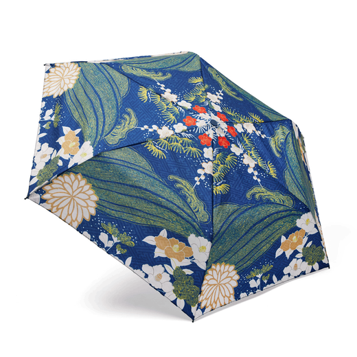 The top of an umbrella featuring a Japanese inspired blue and green print.
