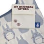A detail of a white tote bag with a pattern featuring an cartoon character and a small square bag with the text My Neighbour Totoro in brown characters.