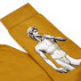 A detail of a pair of mustard yellow socks featuring Michelangelo's David sculpture.