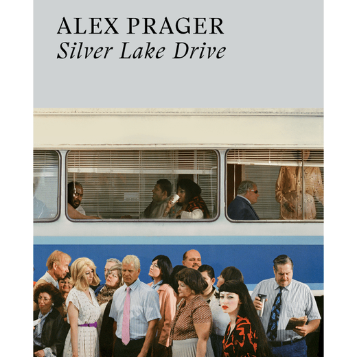 A book cover featuring a coloured photograph of a group of people in front of a blue bus.