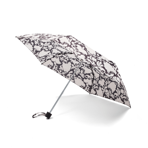 An open umbrella with a black and white floral pattern.