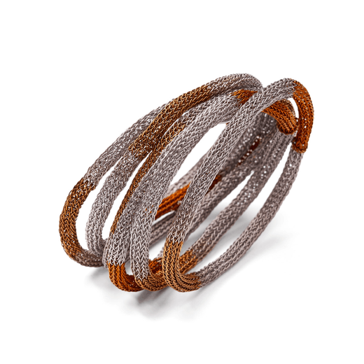 A set of six bracelets in contrasting bronze and silver tones.