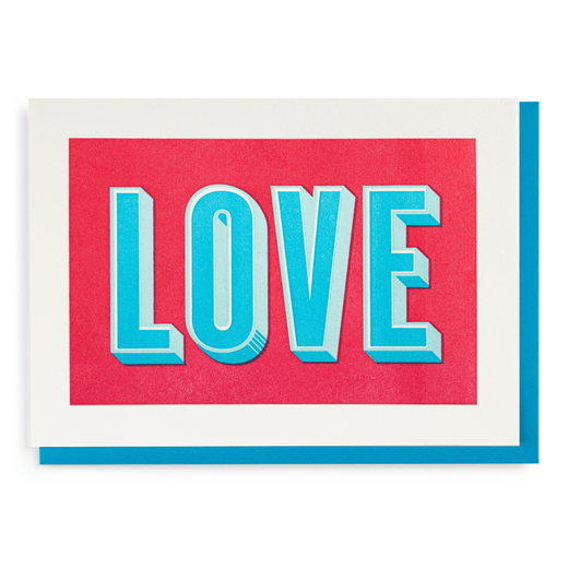 Greeting card with the word "love" printed in capitals in blue on magenta background.