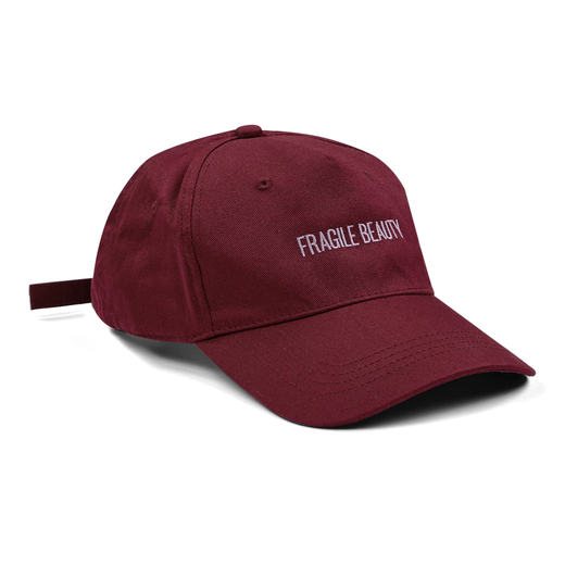 Maroon baseball cap with an embroidered purple text spelling 'Fragile Beauty' in capital letters.