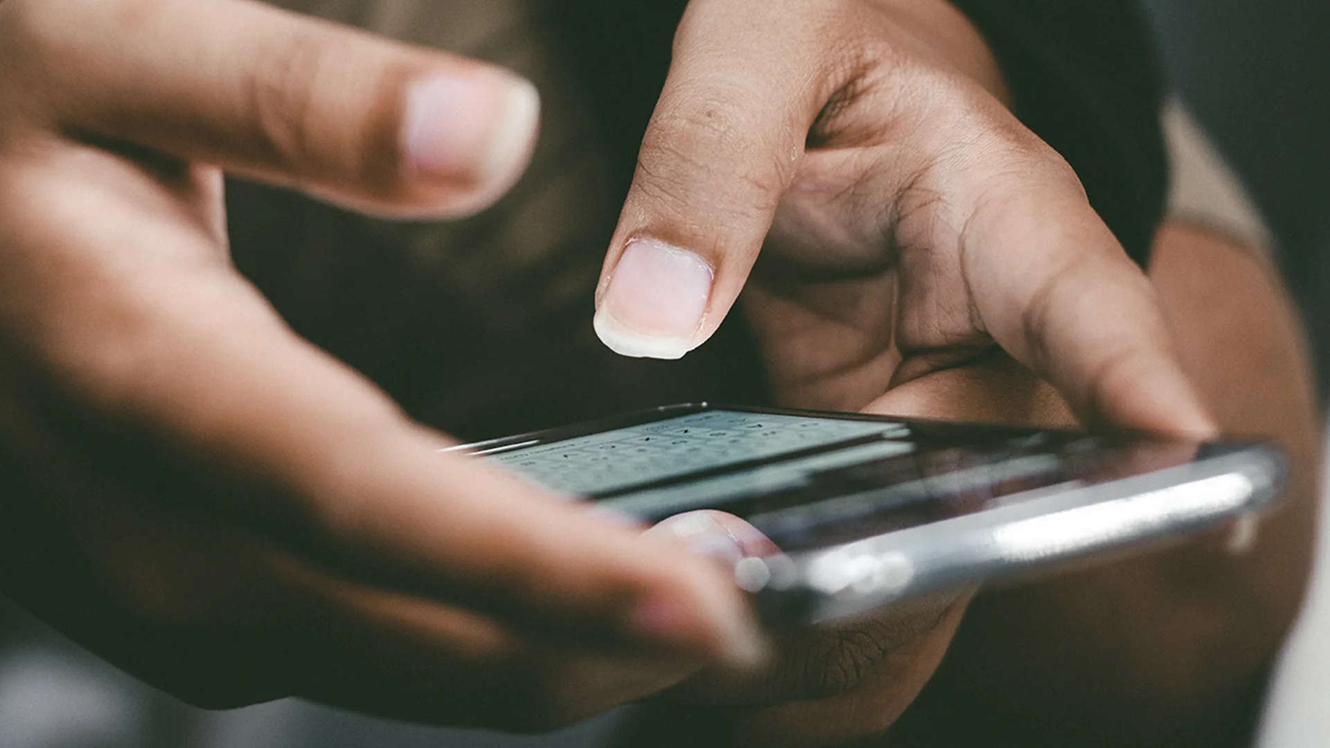 Close up of a person using a cell phone