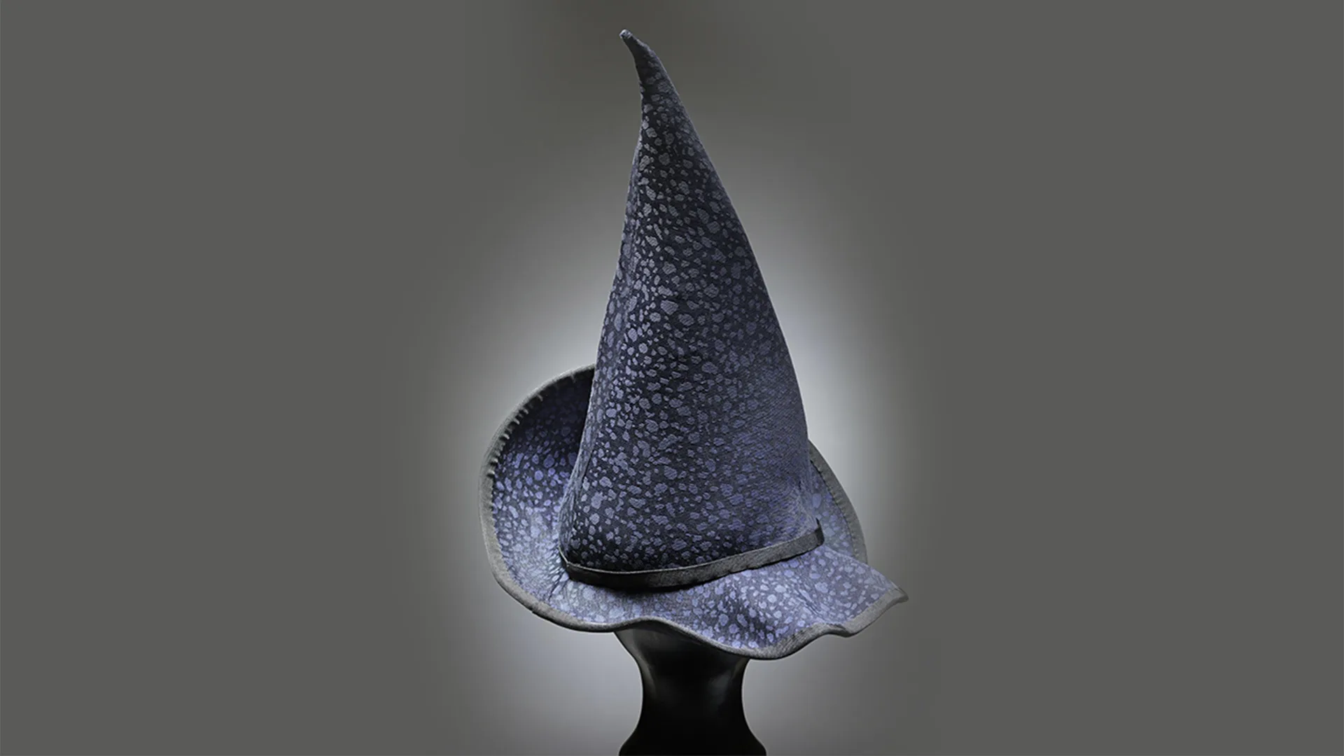 Dark blue fabric witches hat with narrow brim