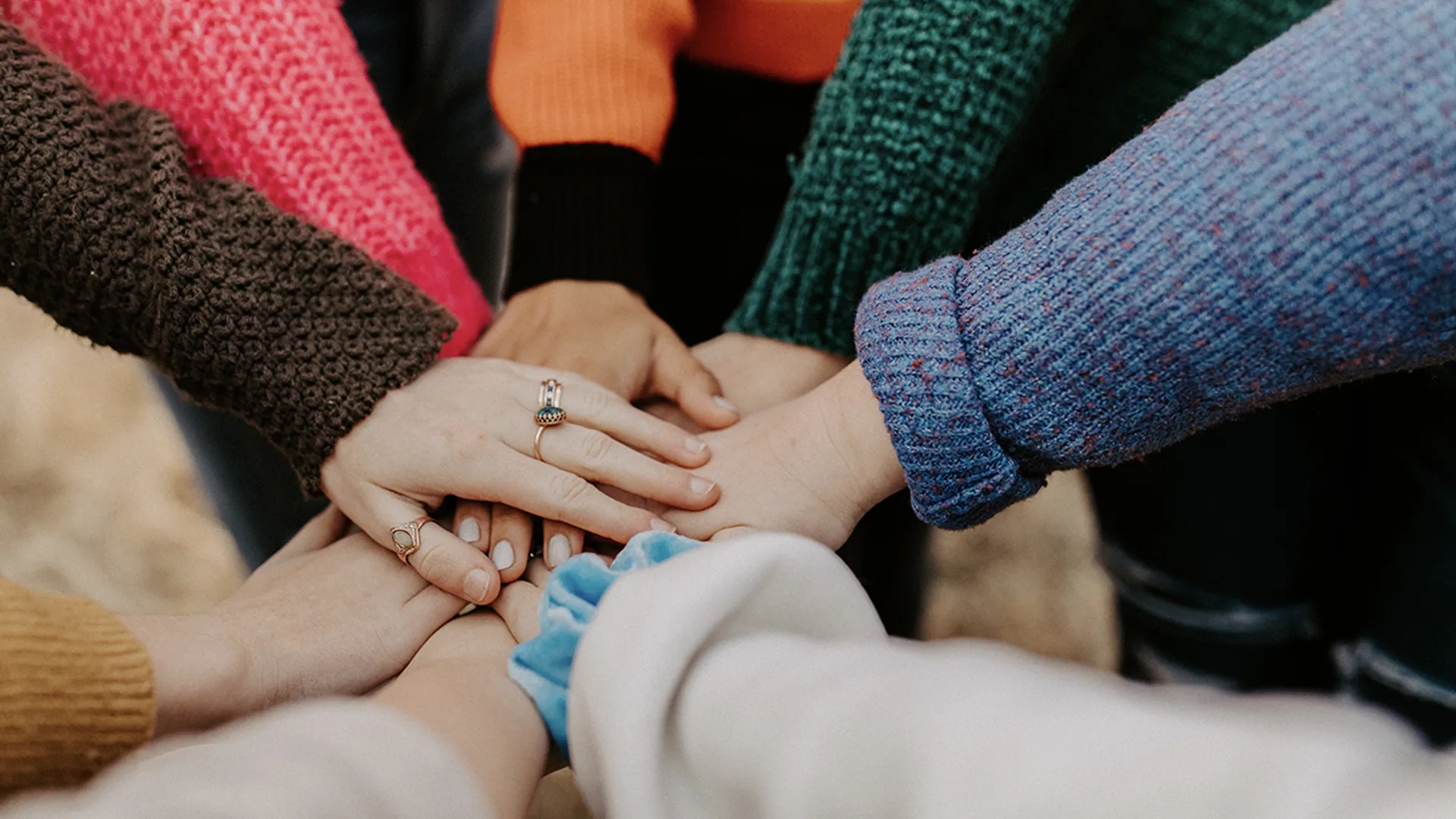 Group of friends holding hands