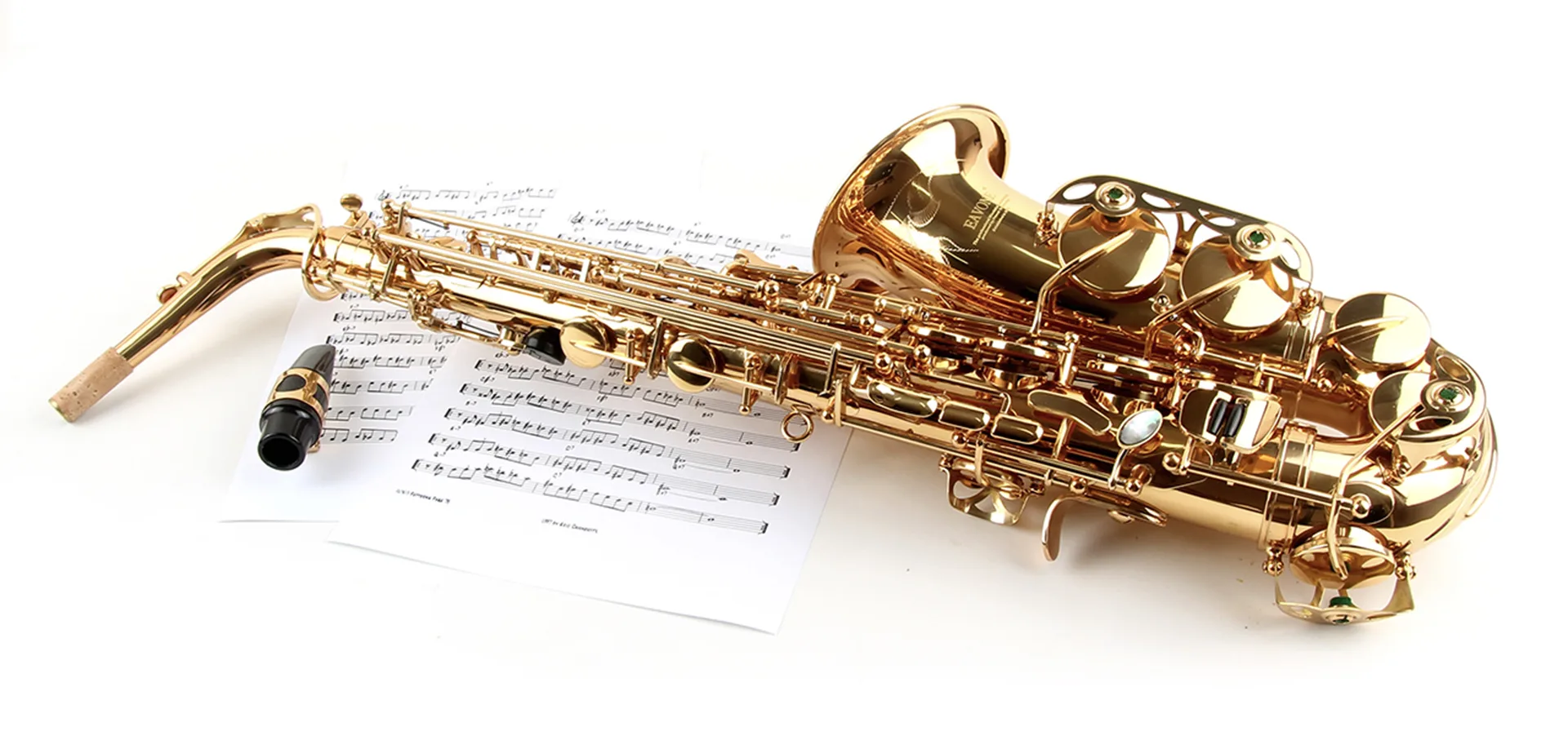 A gold saxophone with some music notes underneath