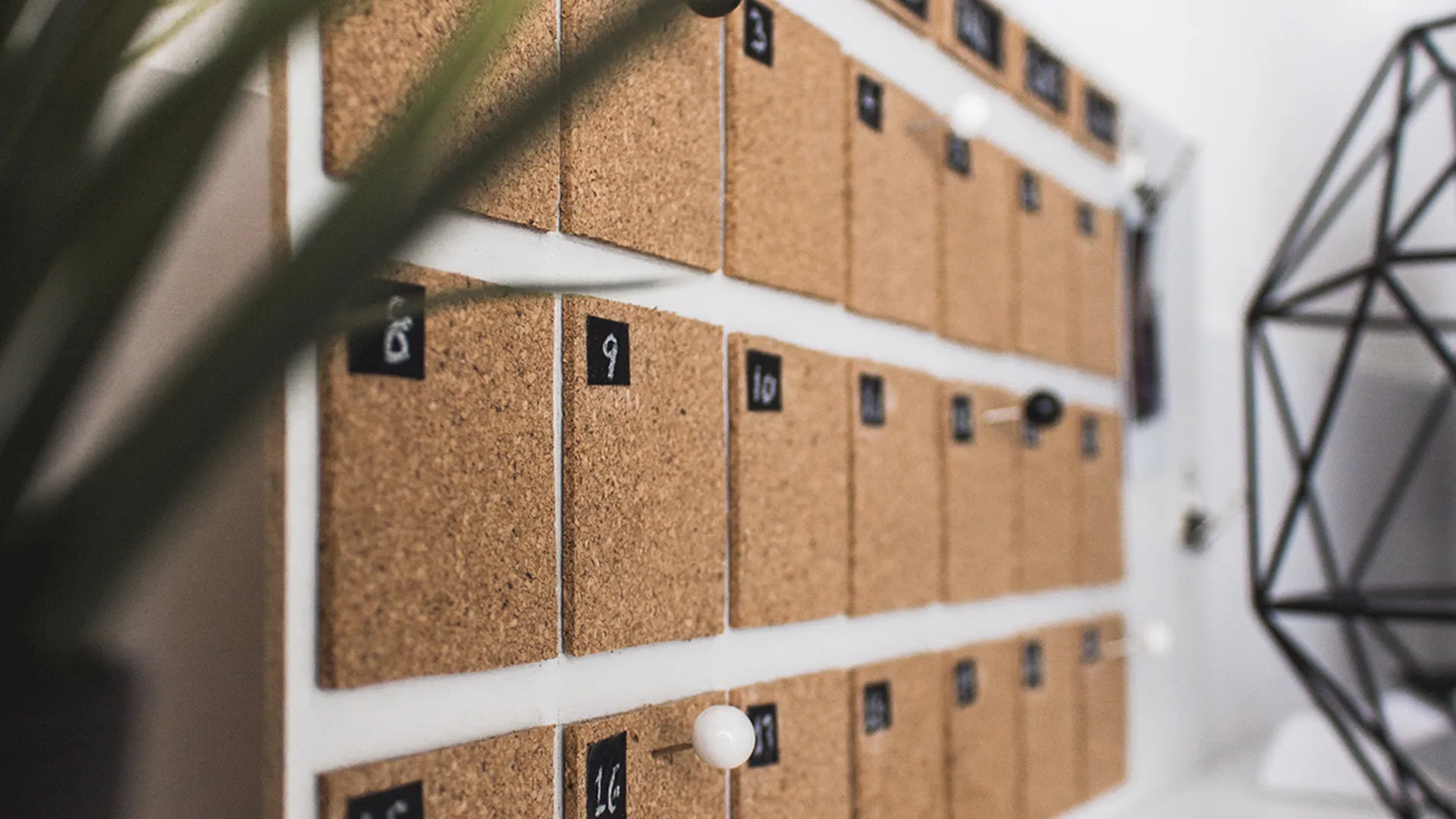 Calendar planner on cork board.