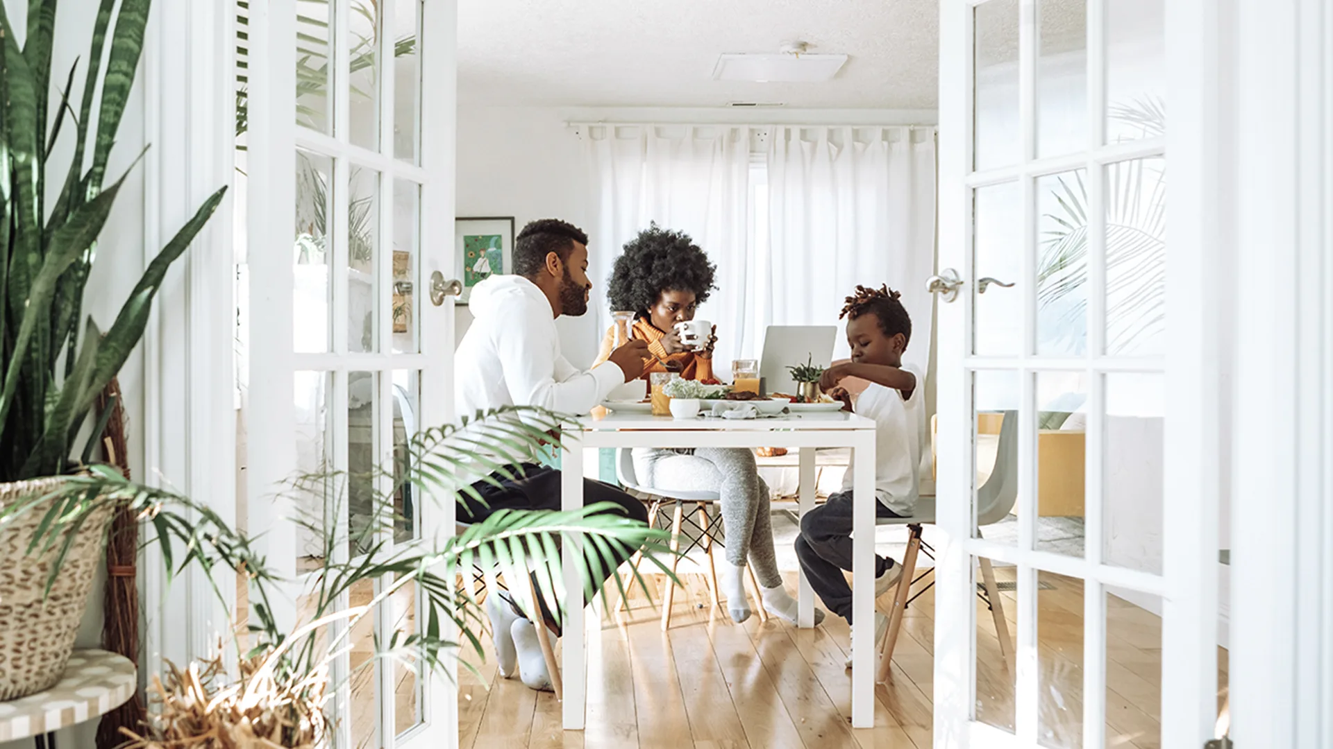 Family sat together at dinner table