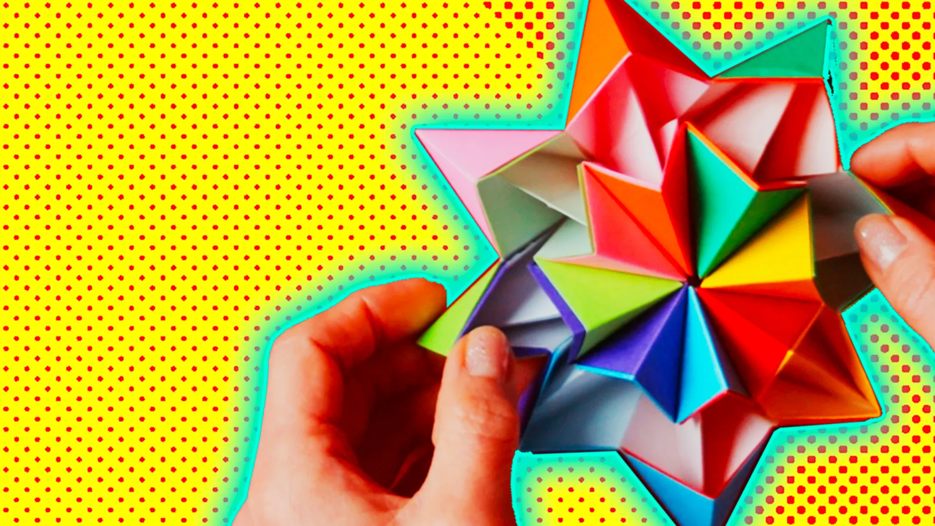 A multicolour paper origami kaleidoscope against a yellow background