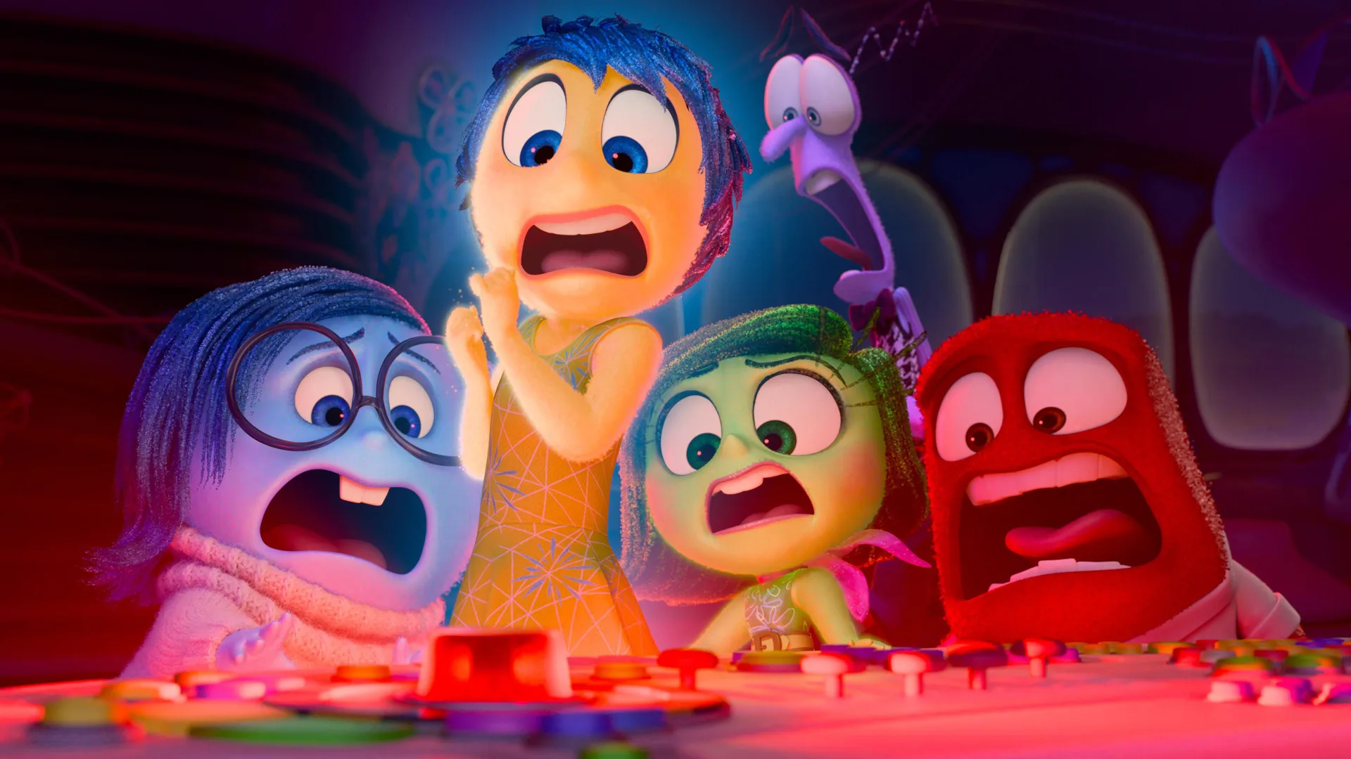 A scene from the Disney Pixar film Inside Out showing the emotions all screaming at the control panel which is flashing a red light