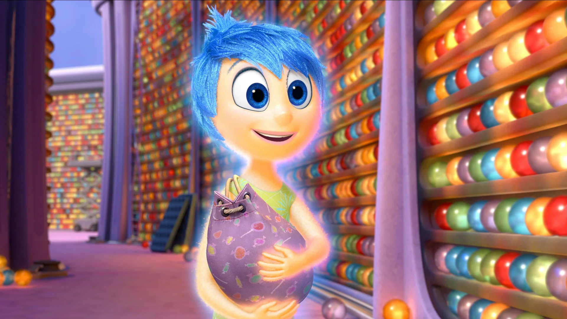 A scene from Disney/Pixar's Inside Out showing Joy holding a bag of memories and smiling at someone off camera