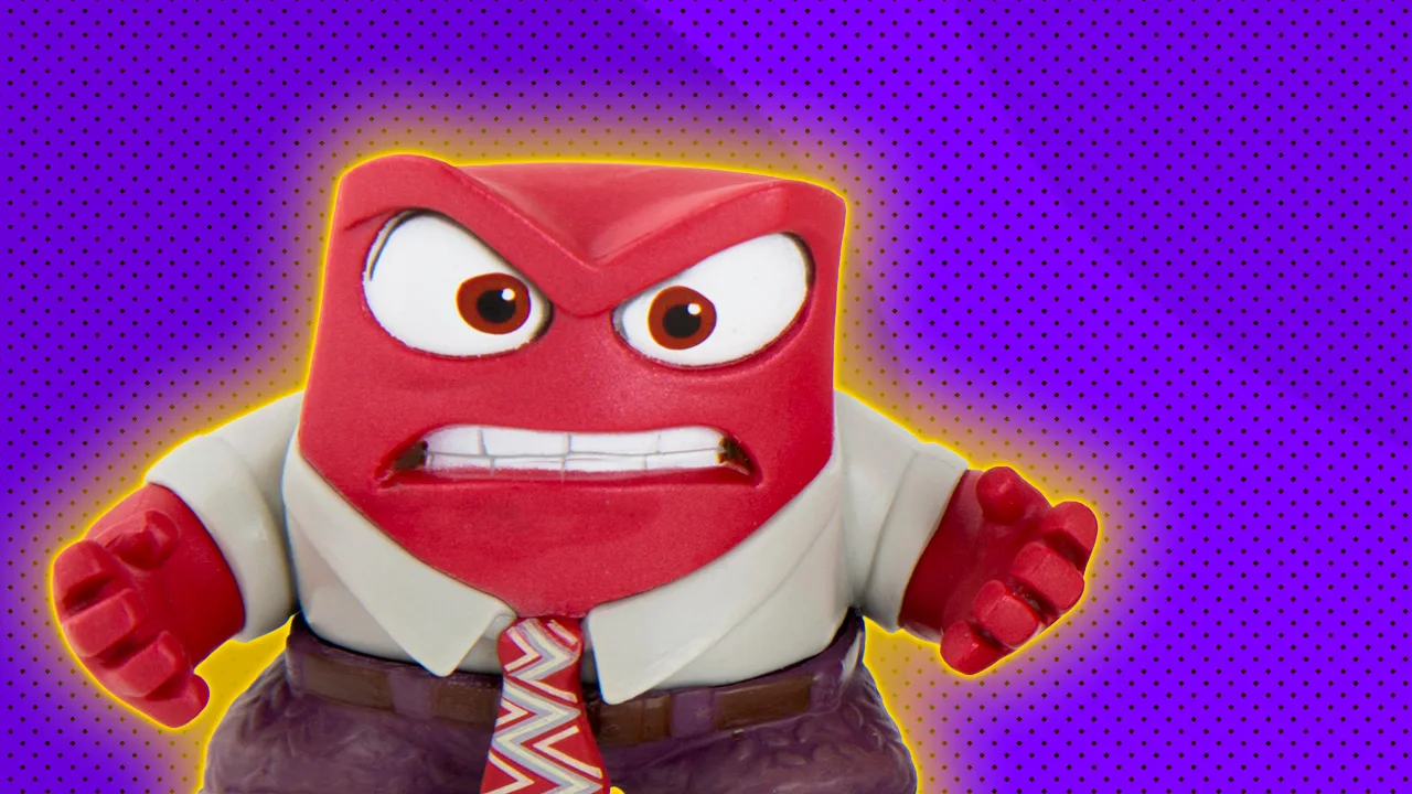 A photo of the emotion Anger from Disney Pixar Inside Out with an angry expression against a purple dotted background with a yellow halo