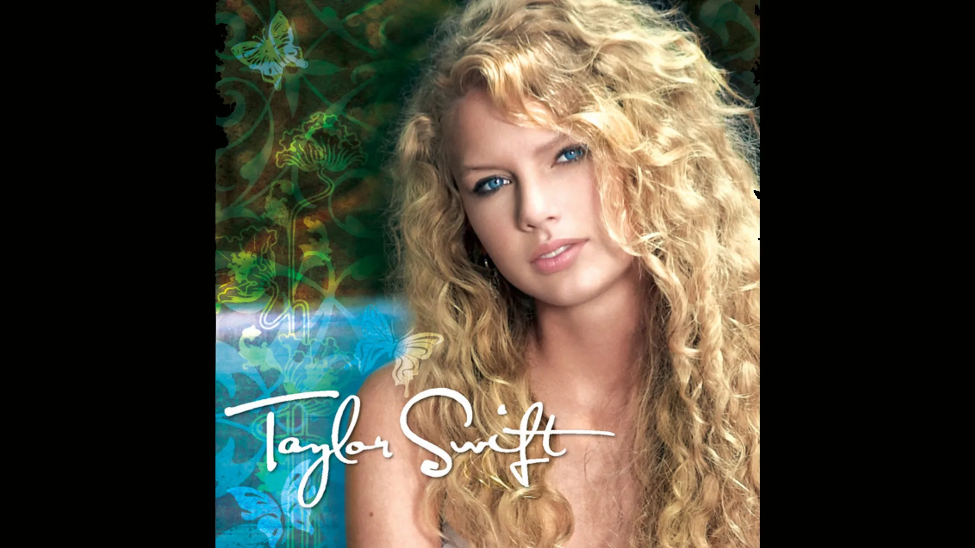 An image of Taylor Swift's first album cover 'Taylor Swift' with an image of her wearing her hair long blonde and curly with 'TAYLOR SWIFT' in cursive writing bottom left and a faded image of plants and butterflies of blues and greens.