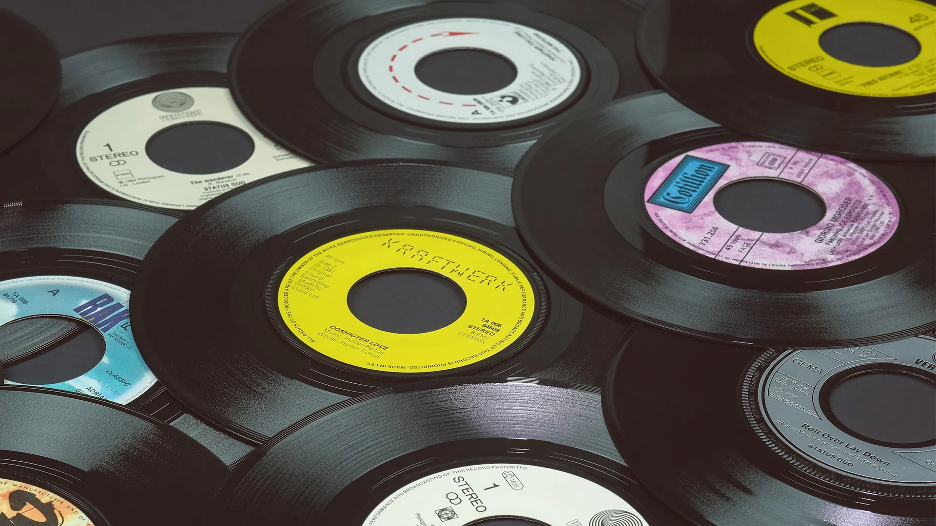 Black Vinyl records, 7 inch singles lying on a flat surface