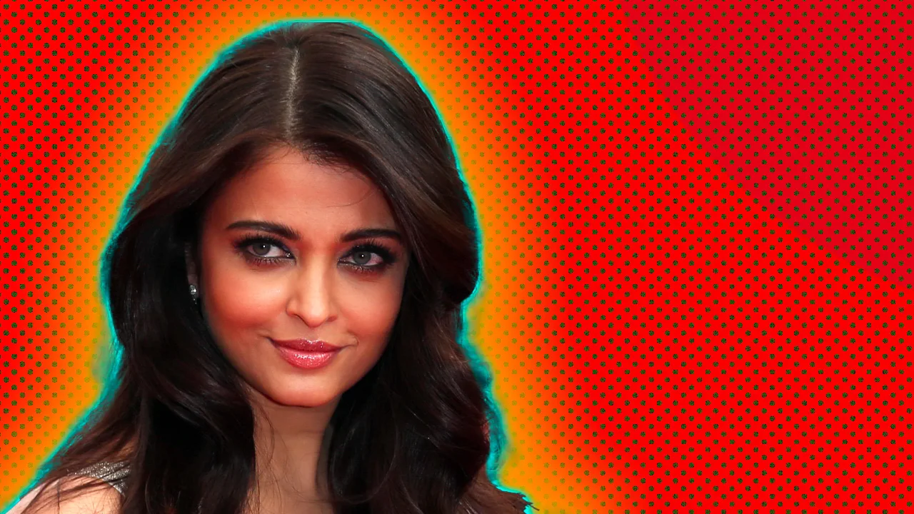 An image of the Bollywood actress Aishwarya Rai smiling with a blue and orange halo against a red dotted background