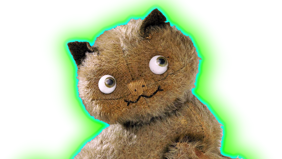 A photo of a cat toy with a cheeky face in brown colours with a blue and green halo,