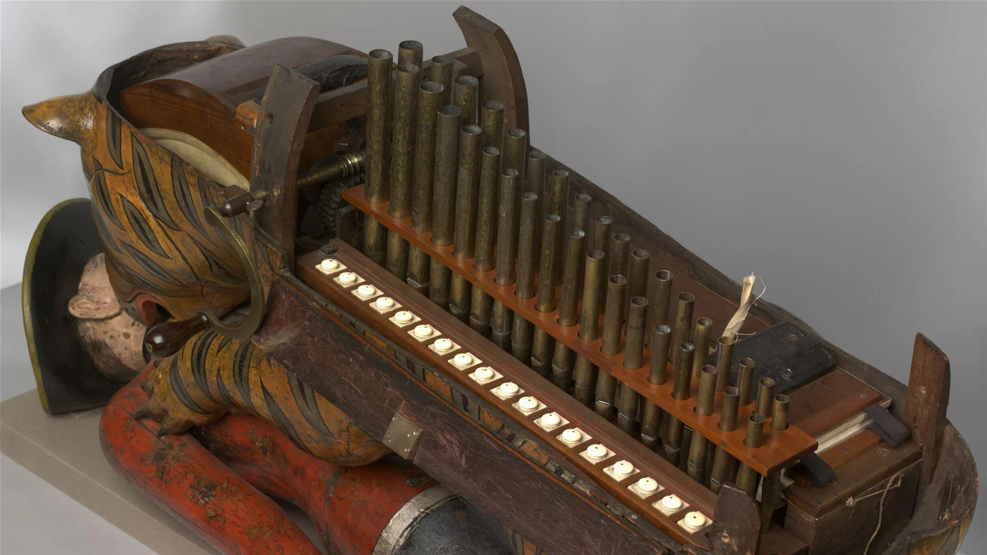 A close up of the V&A object Tippoo's Tiger showing the in-built organ on the side of the tiger.