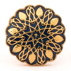 An intricate mandala-esque motif inspired by the Mughal jalis, made of fine enamel and gold.