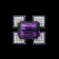 An elegant purple jewel on a geometric setting of diamonds and sapphires