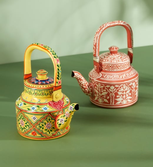 Two patterned painted kettles 