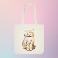 An off white tote bag featuring an illustration of a kitten against a gradient pastel colours background.