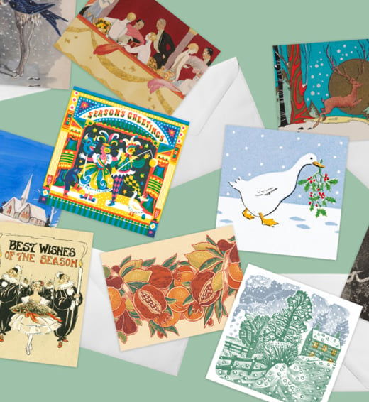 Scattered Christmas Cards with assorted festive designs inspired by the V&A Archives